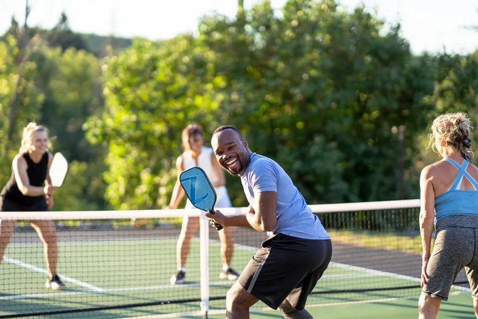 A man playing pickleball